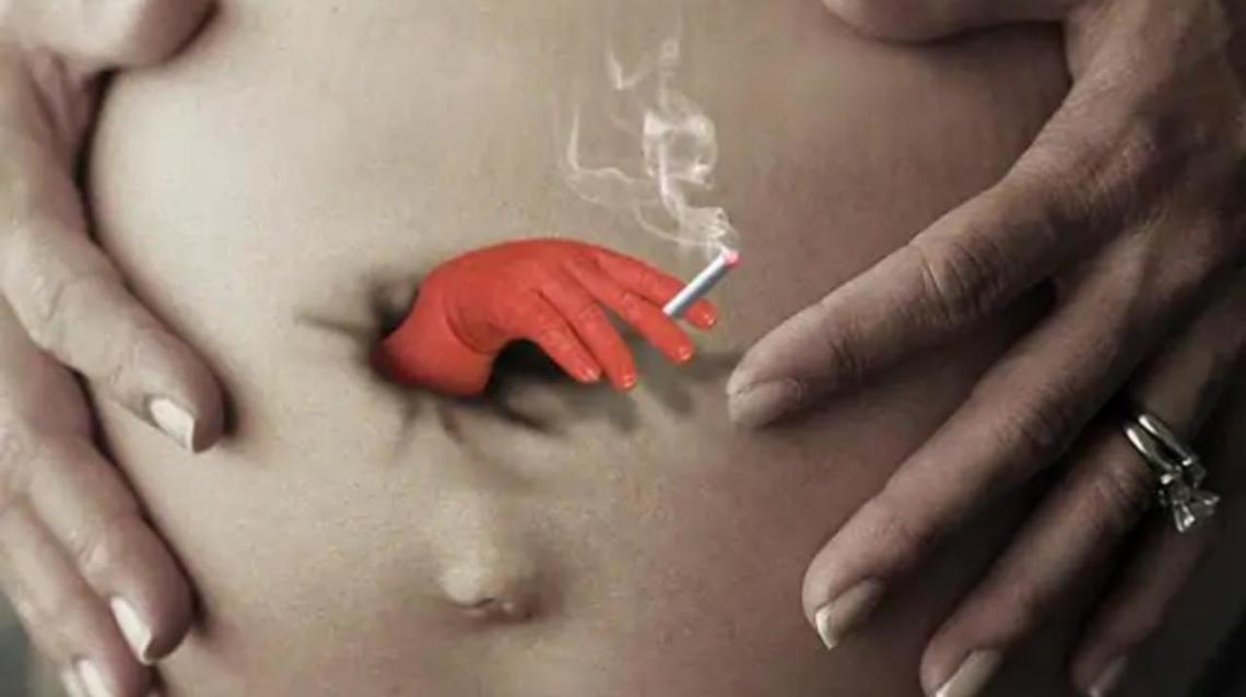 cigarette in navel belly button Smoking During Pregnancy: "SMOKING BELLY" Outdoor Advert by Serviceplan Munich My friend can hold 4